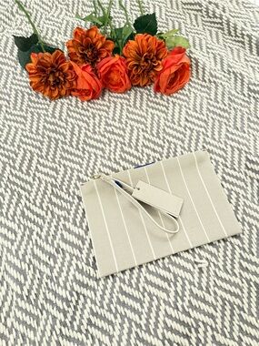 Rothy’s Striped Beige Wristlet Clutch